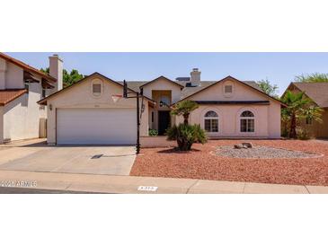 Charming single-story home with a two-car garage, desert landscaping, and basketball hoop in a desirable neighborhood at 4313 E Briarwood Ter, Phoenix, AZ 85048