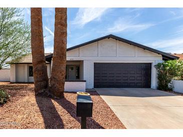 Charming single-story home with a well-maintained front yard and a two-car garage at 4510 N 105Th Ave, Phoenix, AZ 85037