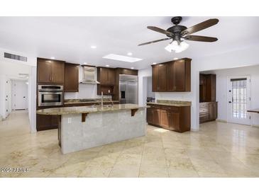 Spacious kitchen with granite counters, stainless appliances and tile flooring throughout at 1059 E Broadmor Dr, Tempe, AZ 85282