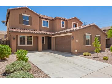 Charming two-story home with a spacious driveway and well-maintained landscaping at 12029 W Overlin Ln, Avondale, AZ 85323