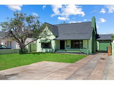 Charming single-Gathering home featuring a well-manicured lawn and vintage architectural details at 2230 N 12Th St # Rear, Phoenix, AZ 85006