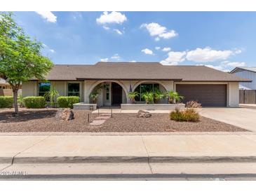 Charming single-story home with a well-manicured front yard and an inviting arched entryway at 2616 S El Dorado --, Mesa, AZ 85202