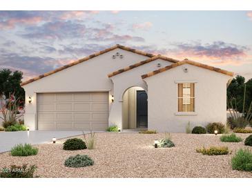 Charming single-story home with desert landscaping and a two-car garage, perfect for modern living at 39985 W Sparks Ln, Maricopa, AZ 85138