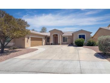 Charming single-story home featuring a circular driveway and well-maintained landscaping at 2041 E Palm Beach Dr, Chandler, AZ 85249