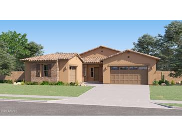 Charming single-story home with desert landscaping, a stone facade, and a two-car garage at 3385 E Saddletree Way, San Tan Valley, AZ 85140