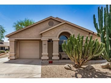 Charming home with a desert-landscaped front yard and a covered entryway at 6621 S Coral Gable Dr, Chandler, AZ 85249