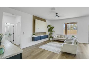 Bright living room featuring modern decor and a comfortable seating area at 8137 W Pueblo Ave, Phoenix, AZ 85043