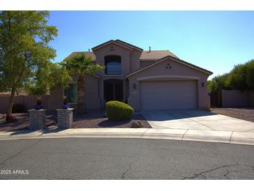 Charming two-story home featuring desert landscaping and a spacious two-car garage at 8920 S 40Th Ln, Laveen, AZ 85339
