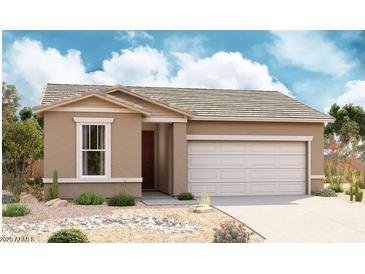 Charming single-story home with a two-car garage and desert landscaping, showcasing a cozy and inviting curb appeal at 18503 E Dario Rd, Gold Canyon, AZ 85118