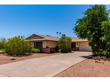 Well maintained, single story home with mature trees and long drive way at 2716 S Terrace Rd, Tempe, AZ 85282