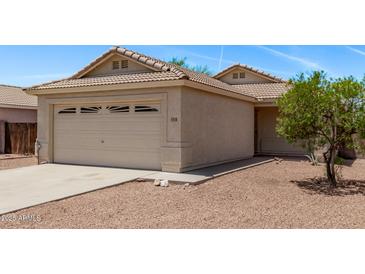 Charming single-story home featuring a two-car garage and a well-maintained, low maintenance desert landscape at 330 S Valley Dr, Apache Junction, AZ 85120