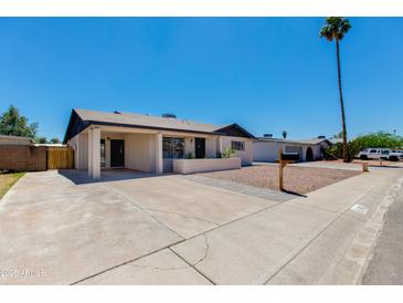 Charming single-story home with well-maintained landscaping and inviting curb appeal on a bright, sunny day at 4325 W Sierra St, Glendale, AZ 85304