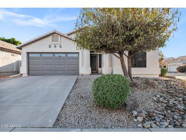 Charming single-story home with a well-maintained front yard and desert landscaping details at 896 N Kingston St, Gilbert, AZ 85233