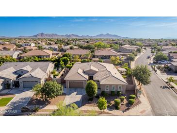 A beautiful single-Gathering home with a well-maintained yard and a stunning view of the mountains in the background at 22323 E Via Del Jardin --, Queen Creek, AZ 85142
