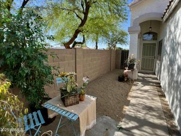 Cozy front yard patio with chairs and garden decor at 4925 W Bluefield Ave, Glendale, AZ 85308