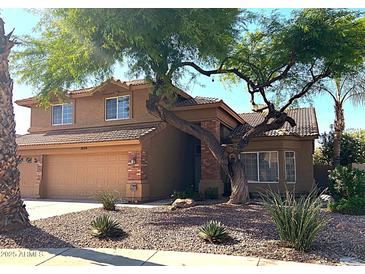 Two-story home with desert landscaping, brick accents, and a spacious two-car garage at 1838 W Enfield Way, Chandler, AZ 85286