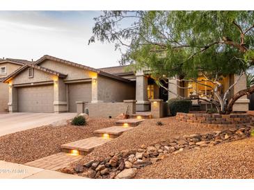 Beautiful, well-maintained single-story home with a three-car garage and desert landscaping at 4422 E Spur Dr, Cave Creek, AZ 85331