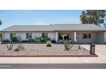 Charming single-story home featuring desert landscaping, a welcoming front porch, and a well-maintained exterior at 3759 E Charter Oak Rd, Phoenix, AZ 85032
