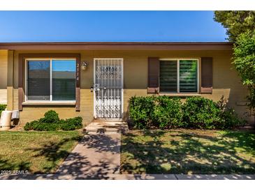 Inviting single story home featuring a secure front door and well-maintained landscaping at 2514 N 22Nd Ave, Phoenix, AZ 85009