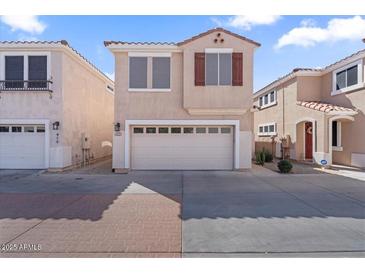 Attractive two-story home featuring a two-car garage and a well-maintained exterior at 421 W Mountain Sage Dr, Phoenix, AZ 85045