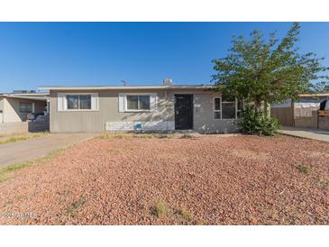 Charming single-story home with a low-maintenance rock front yard at 7619 W Clarendon Ave, Phoenix, AZ 85033