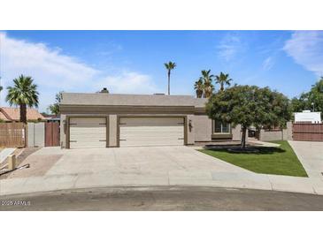Charming home featuring a two-car garage and well-maintained landscaping at 1670 E Whitten St, Chandler, AZ 85225