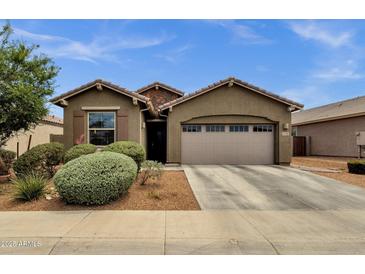 Charming single-story home featuring a well-manicured yard and a spacious two-car garage at 1725 E Chanute Pass --, Phoenix, AZ 85040