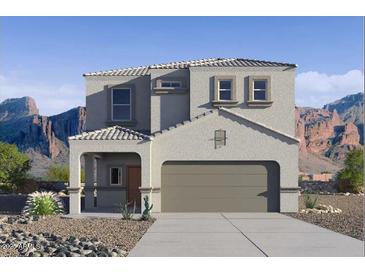 Beautiful two-story home with a neutral color scheme and a mountain backdrop at 4999 E Umber Rd, San Tan Valley, AZ 85143