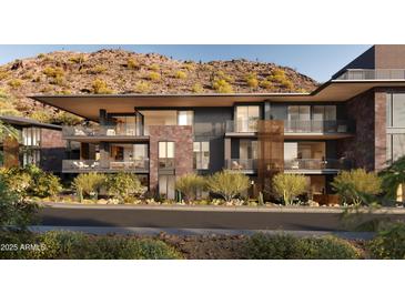 Modern condo exterior featuring balconies with mountain views and desert landscaping for an inviting outdoor living experience at 5050 N Camelback Ridge Dr # 2101, Scottsdale, AZ 85251
