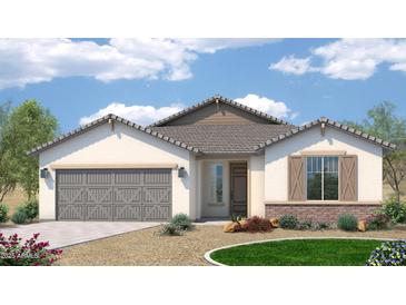 Charming single-story home showcasing a neutral color palette, complemented by desert landscaping and a welcoming two-car garage at 1172 E Ridgerock St, Casa Grande, AZ 85122