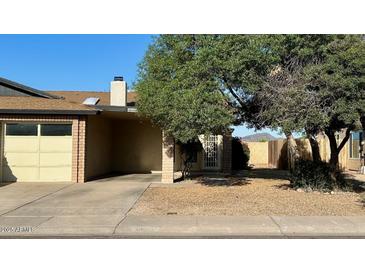 Charming single-story home with a well-maintained front yard and attached garage at 13041 N 51St Dr, Glendale, AZ 85304