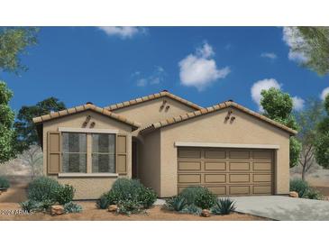 Charming single-story home with a two-car garage, desert landscaping, and a neutral color palette under a clear blue sky at 18161 W Cielo Grande Ave, Surprise, AZ 85387