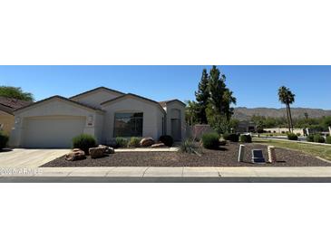 Charming single-story home with well-maintained landscaping and a two-car garage at 2013 E Valencia Dr, Phoenix, AZ 85042