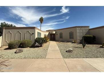 Charming single-story home featuring a desert landscaped yard and a welcoming entranceway at 13857 N 108Th Dr, Sun City, AZ 85351