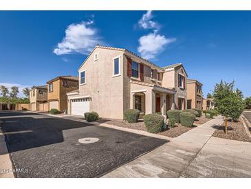 Charming two-story home featuring desert landscaping, a two-car garage, and a tiled roof at 2862 E Megan St, Gilbert, AZ 85295