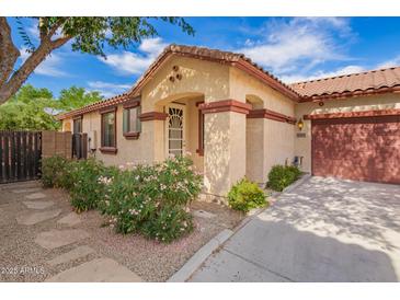 Charming single-story home with desert landscaping and a covered front porch at 6359 S Forest Ave, Gilbert, AZ 85298