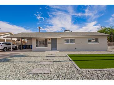 Well-maintained single-story home with low-maintenance desert landscaping at 143 W Ray Rd, Chandler, AZ 85225