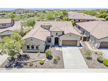 Stunning single-story home showcasing a tile roof, neutral stucco, and a well-manicured desert landscape at 30374 N 124Th Dr, Peoria, AZ 85383