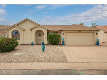 Charming single-story home with well-maintained landscaping and attached two-car garage at 6160 S Pebble Beach Dr, Chandler, AZ 85249