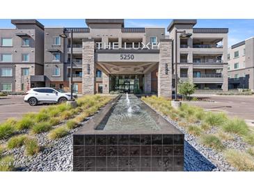 Modern apartment complex featuring a water feature and well-maintained landscaping at 5250 E Deer Valley Dr # 247, Phoenix, AZ 85054
