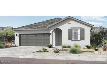 Charming single-story home featuring a gray roof, grey shutters, stucco walls, and a two-car garage at 14403 W Sand Hills Rd, Surprise, AZ 85387