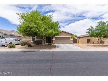 Charming single-Gathering home with a desert landscape and a spacious two car driveway at 4216 W Harwell Rd, Laveen, AZ 85339