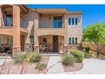 Charming two-story home with a well-manicured yard and a welcoming entrance with desert landscaping at 2821 S Skyline Dr # 157, Mesa, AZ 85212
