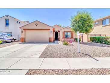 Charming single-story home featuring a desert landscape, two car garage, and covered entry at 4323 S Ranger Trl, Gilbert, AZ 85297