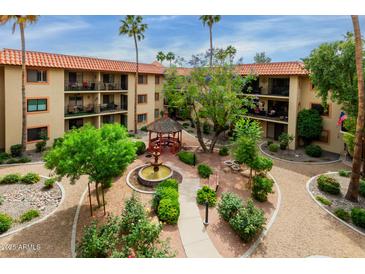 An aerial view of a well manicured courtyard featuring a gazebo, mature trees, and well-kept landscaping at 10330 W Thunderbird Blvd # A301, Sun City, AZ 85351