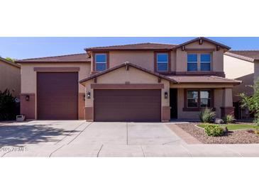 Charming two-story home featuring a three-car garage and low-maintenance landscaping at 12226 W Planada Ln, Sun City, AZ 85373