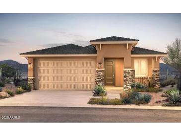 Charming single-story home with desert landscaping, a two-car garage, and stone facade accents at 13573 W Cassia Trl, Peoria, AZ 85383
