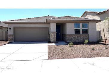 Charming single-story home featuring a two-car garage and low-maintenance desert landscaping at 17505 W Fulton St, Goodyear, AZ 85338