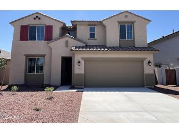 Inviting two-story home featuring a neutral color palette and a spacious two-car garage at 17511 W Fulton St, Goodyear, AZ 85338