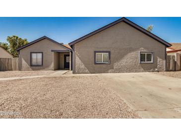 Charming single-story home with low maintenance desert landscaping and newer roof at 7506 W Sells Dr, Phoenix, AZ 85033